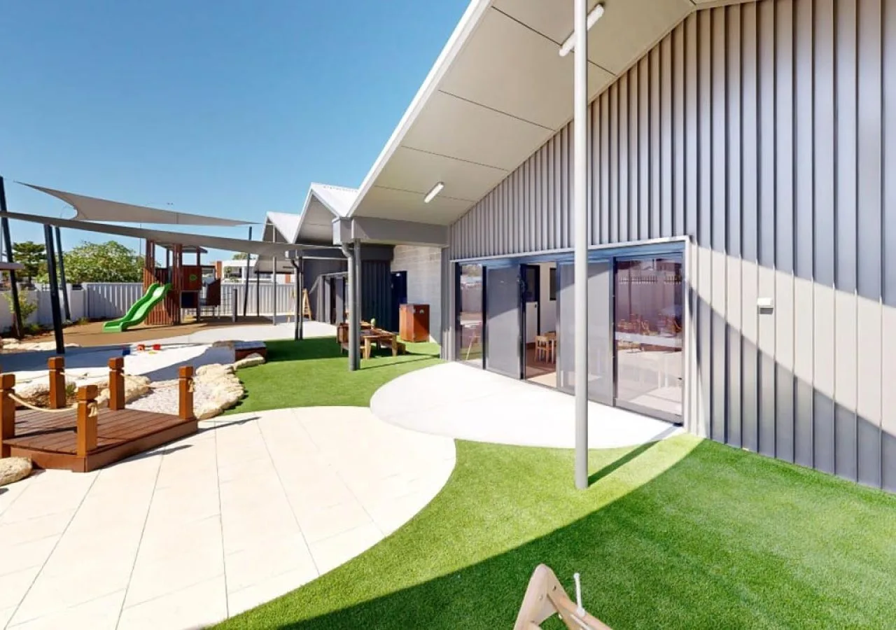 Landscaped grounds and garden beds around a building