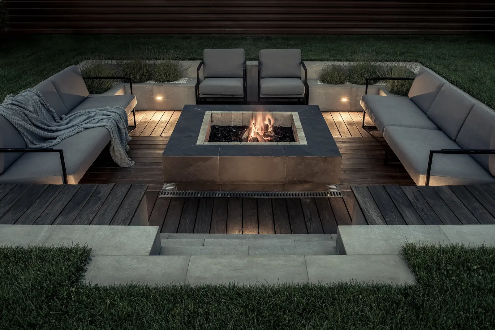 An outdoor fire pit and seating area