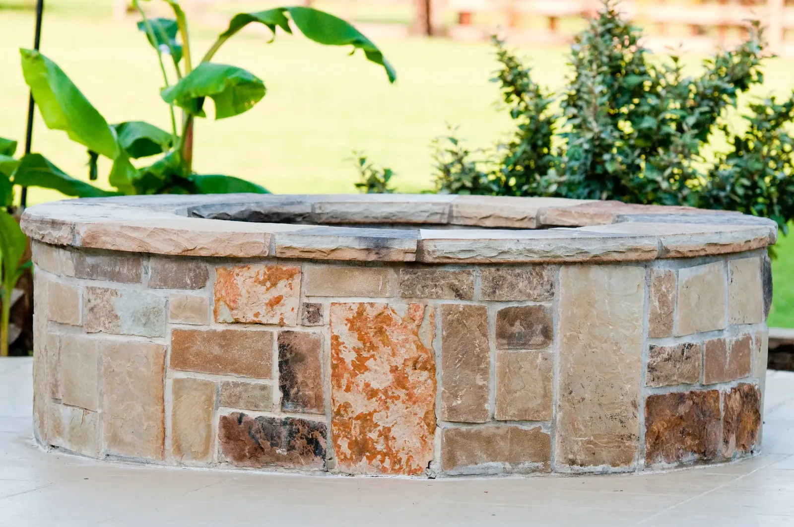A round stone fire pit feature