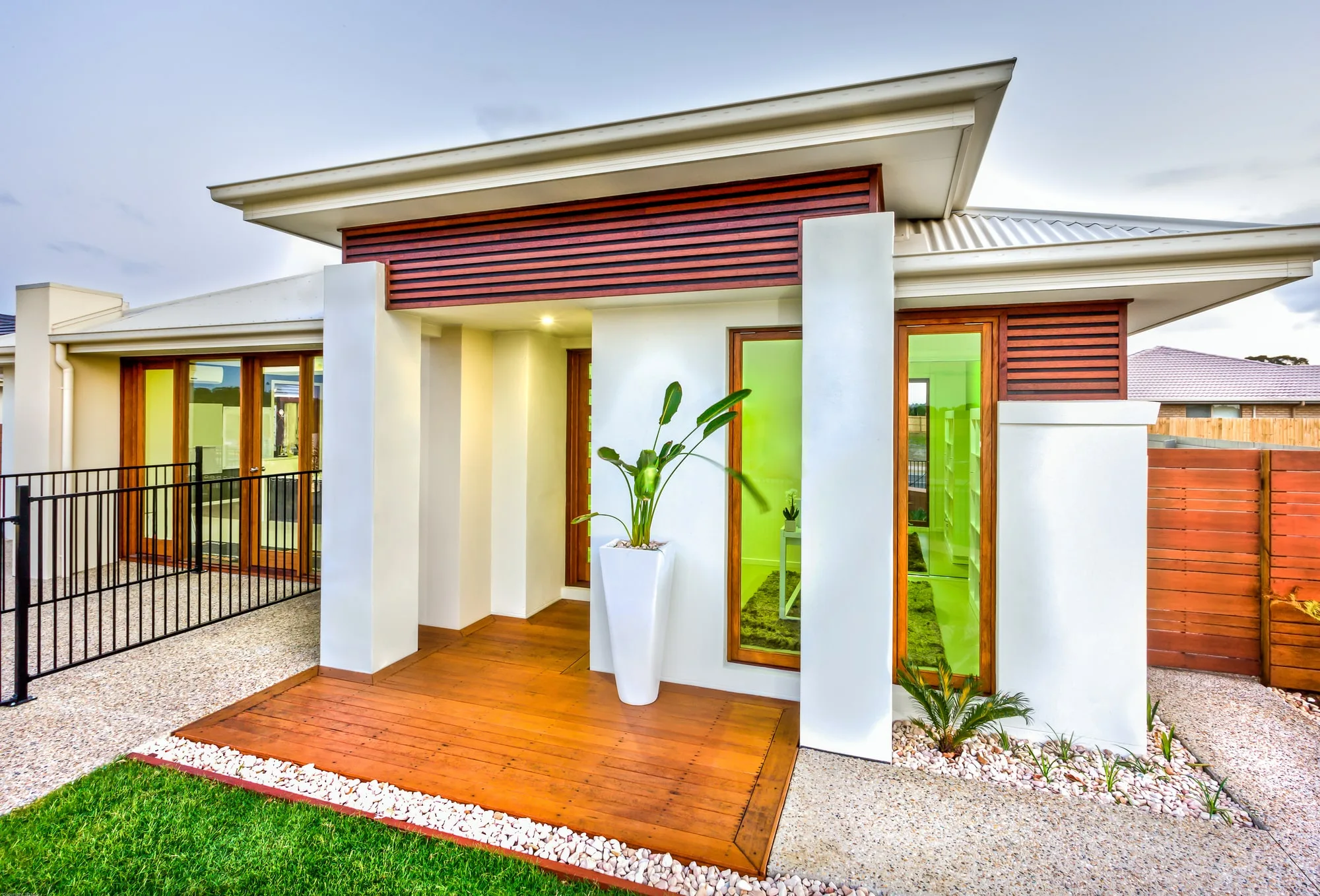 A timber deck at a home's covered entrance